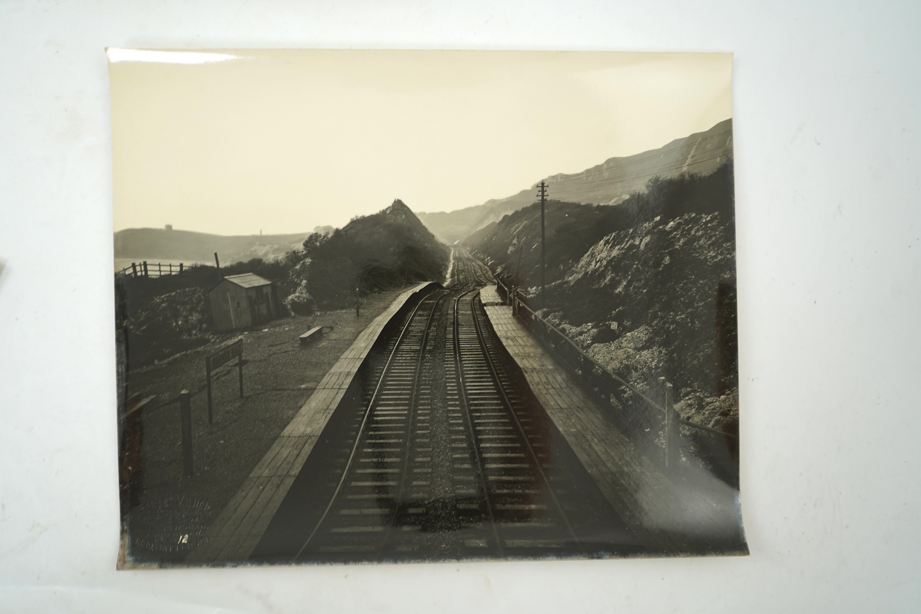 Fourteen late 19th/early 20th century black and white photographs of the results of a chalk landslide on the SE&CR, South East and Chatham Railway, at East Wear Bay, Capel-le-Ferne, Kent, with annotations to the reverse